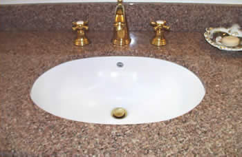 Private Residence, Hillsborough.  This vanity is made of a stone that is no longer readily available, Golden Juperana. The category of granites known as Juperanas are typified by fine to medium grain crystals that swirl and "move". This group of stones is often appealing to people lookin