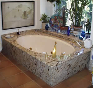 Private Residence, North Raleigh. A pre-existing bathtub on the second story of this home presented a challenge to us! We were asked to design a granite tub deck to sit upon it and to integrate the splashes with a pre-existing window sill. The end result is stunning. The granite used is k