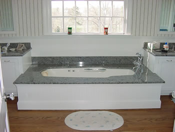 Private Residence, Orange County. These vanities and undermounted tub deck are fabricated from a blue-toned Indian granite and are in a private residence in Orange County.