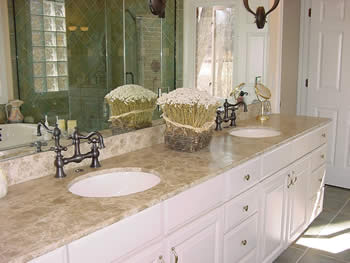 Private Residence, Chapel Hill. Cedar limestone was used on the master bath vanities in this Chapel Hill residence. This stone, with a beige/brown background and light veins, creates a soft, rich color palette in this bath.