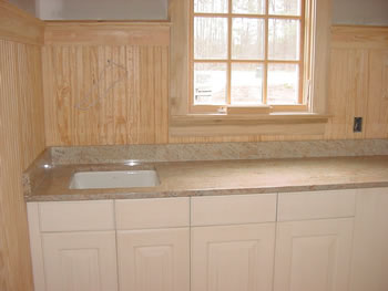 Private Residence, Chapel Hill. Use of granite in the Laundry Room is a natural solution for your countertop needs! This Chapel Hill residence features a white cast iron undermount laundry sink set under Ivory Chiffon granite. The soft, subtle shades of this stone blend beautifully with