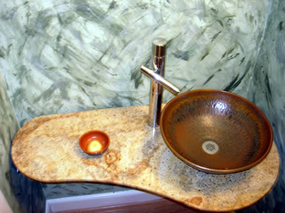 Private Residence, Durham In the vicinity of Duke University, this Powder Room underwent a transformation.  To complement the Juperana Fantastico granite, the customer commissioned a local artist to make the sink.  Prescott Stone rendered several designs for this tiny space and, u