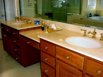 Private Residence, North Raleigh. These vanities were fabricated of 2cm Giallo Elan marble quarried in Turkey.  Coordinating marble tiles were used for the flooring and the tub deck.