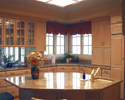 Private Residence, Chapel Hill. This couple replaced their kitchen cabinets and decided to upgrade their counters to granite.  They selected a Brazilian stone, Juperana Colombo.  This stone has fine to coarse crystals with lots of swirls and is often available in oversized slabs often a