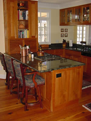 Private Residence, Chapel Hill. Verde Maritaka granite, characterized by lots of swirls and movement, was used in this Chapel Hill kitchen. The clients collaborated with us on the layout of the stone to ensure that the part they liked best was prominently featured.