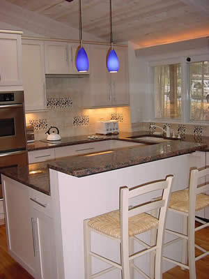 Private Residence, Durham. This Durham couple selected Amazon Blue granite from India to coordinate with handmade tile accents. The stone has a vivid blue accent crystal and the dominant color ranges from brown to peach.