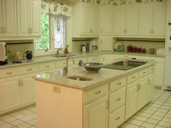 Private Residence, Durham. This couple replaced their dark tile counters with Kashmir White granite which is quarried in India. The before and after pictures illustrate the dramatic difference this upfit made in their kitchen. Due to the unpredictable patterns in each slab of stone