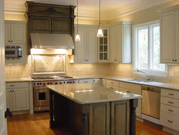 Chapel Hill Parade of Homes, Fall 2002. This Parade kitchen was designed to exploit the subtle green hues in the Verde Eucalyptus granite used on the island and counters. This granite is quarried in Brazil and has some charcoal grains that tie in well with the stainless steel.