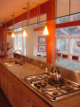 Private Residence, Chapel Hill. This Chapel Hill kitchen remodel integrates a stainless steel backsplash with the granite. This granite, known as Tropical Violet, is actually a deep, rich, green with a right to left grain. It has deep, rich, red highlights.