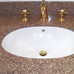 Private Residence, Hillsborough.  This vanity is made of a stone that is no longer readily available, Golden Juperana. The category of granites known as Juperanas are typified by fine to medium grain crystals that swirl and "move". This group of stones is often appealing to people lookin