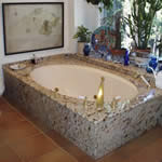 Private Residence, North Raleigh. A pre-existing bathtub on the second story of this home presented a challenge to us! We were asked to design a granite tub deck to sit upon it and to integrate the splashes with a pre-existing window sill. The end result is stunning. The granite used is k