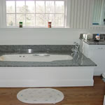 Private Residence, Orange County. These vanities and undermounted tub deck are fabricated from a blue-toned Indian granite and are in a private residence in Orange County.