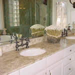 Private Residence, Chapel Hill. Cedar limestone was used on the master bath vanities in this Chapel Hill residence. This stone, with a beige/brown background and light veins, creates a soft, rich color palette in this bath.