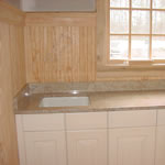 Private Residence, Chapel Hill. Use of granite in the Laundry Room is a natural solution for your countertop needs! This Chapel Hill residence features a white cast iron undermount laundry sink set under Ivory Chiffon granite. The soft, subtle shades of this stone blend beautifully with