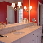 Private Residence, Chapel Hill. This elegant Master Bath Vanity in a Chapel Hill residence features a very traditional Italian marble known as Carrera. The rich wall colour creates a wonderful backdrop for the marble. An integrated shelf adds a detail that creates dimensional interest a