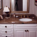 Private Residence, Hillsborough. This vanity is made of a stone that is no longer readily available, Golden Juperana. The category of granites known as Juperanas are typified by fine to medium grain crystals that swirl and "move". This group of stones is often appealing to people looking