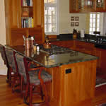 Private Residence, Chapel Hill. Verde Maritaka granite, characterized by lots of swirls and movement, was used in this Chapel Hill kitchen. The clients collaborated with us on the layout of the stone to ensure that the part they liked best was prominently featured.