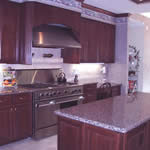 Private Residence, Raleigh. Violetta granite was used for the counters in this kitchen and creates a rich, elegant feeling. The highlights in the Violetta are burgundy/cranberry.