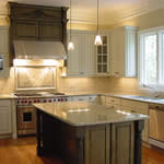 Chapel Hill Parade of Homes, Fall 2002. This Parade kitchen was designed to exploit the subtle green hues in the Verde Eucalyptus granite used on the island and counters. This granite is quarried in Brazil and has some charcoal grains that tie in well with the stainless steel.