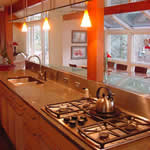 Private Residence, Chapel Hill. This Chapel Hill kitchen remodel integrates a stainless steel backsplash with the granite. This granite, known as Tropical Violet, is actually a deep, rich, green with a right to left grain. It has deep, rich, red highlights.