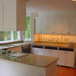 Private Residence, Chapel Hill. This kitchen renovation in Chapel Hill replaced the pre-existing solid surface with New Venetian Gold granite. Functionally, this enhanced the cooktop area as the granite performs very well near heat and will not scorch. The richness and depth of the New 