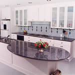 Private Residence, Chapel Hill. Blue Pearl granite, quarried in Norway, was used for the counters in this kitchen. The huge, curved overhang is supported by tubular steel that was designed, fabricated and installed by Prescott Stone Fabricators.