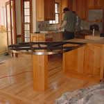 Private Residence, Raleigh. This image of a North Raleigh kitchen depicts the tubular steel substrate that supported a large peninsula.  Prescott Stone Fabricators provides custom designed and fabricated tubular steel supports for any overhangs. Most often, the steel is painted matt